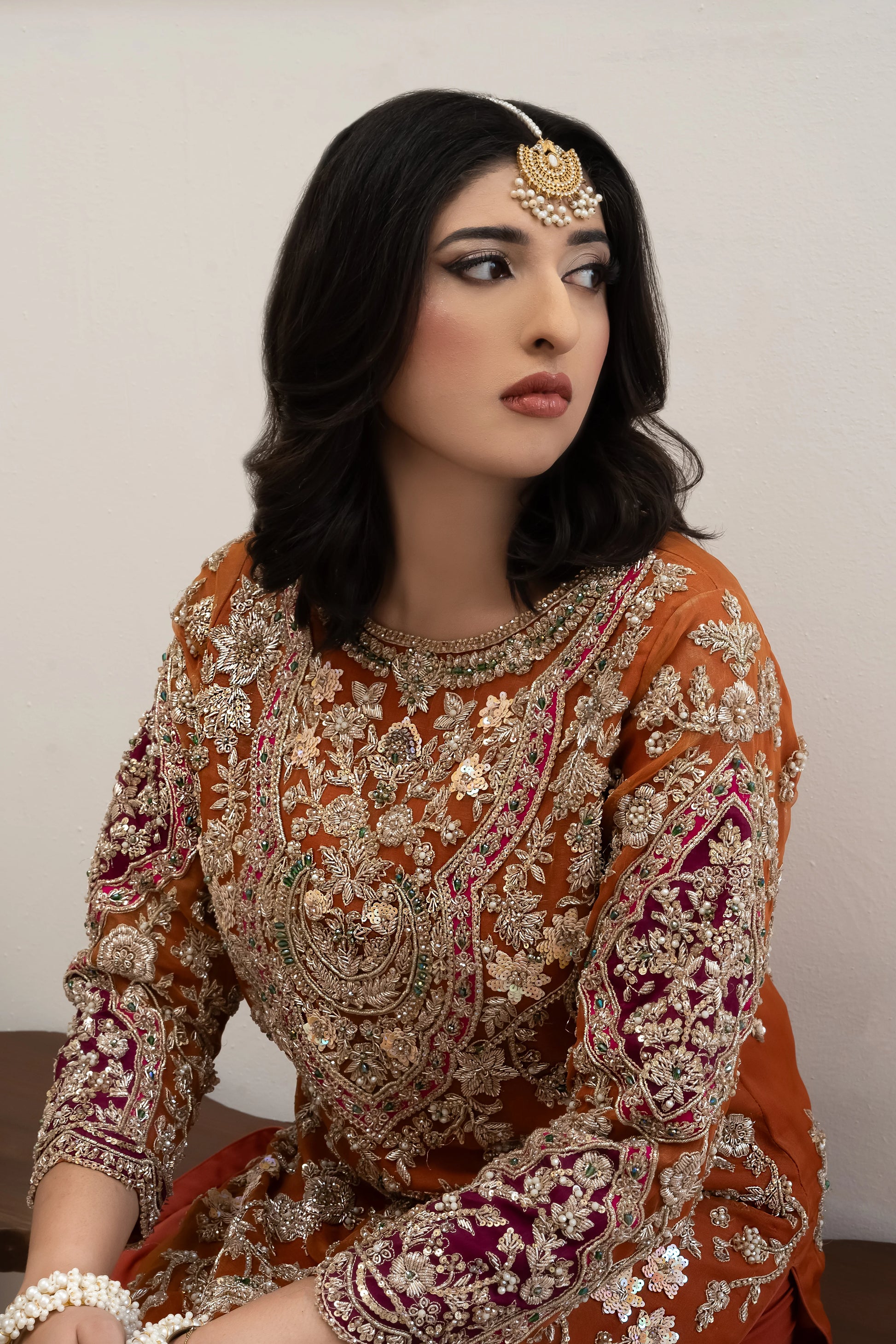 Orange organza wedding outfit with hand-made zari work