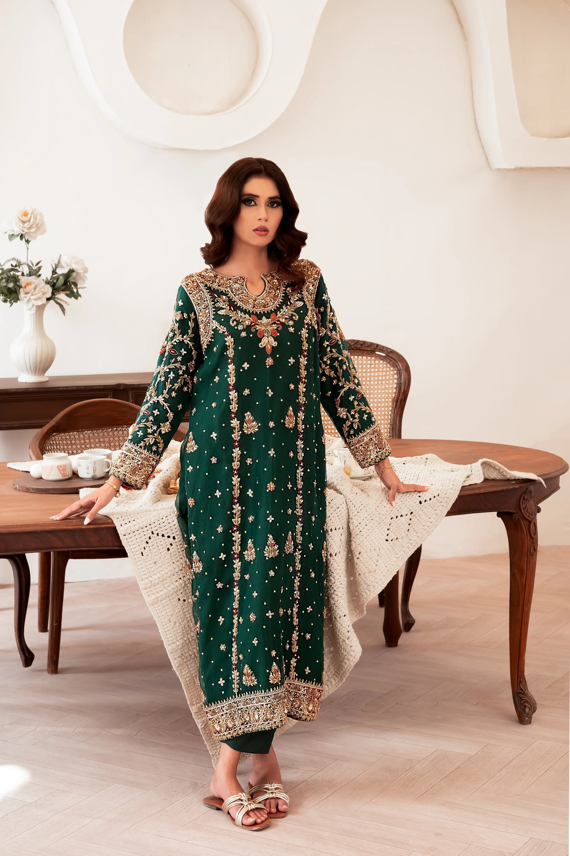 Dark green wedding outfit with hand-made zari work on net