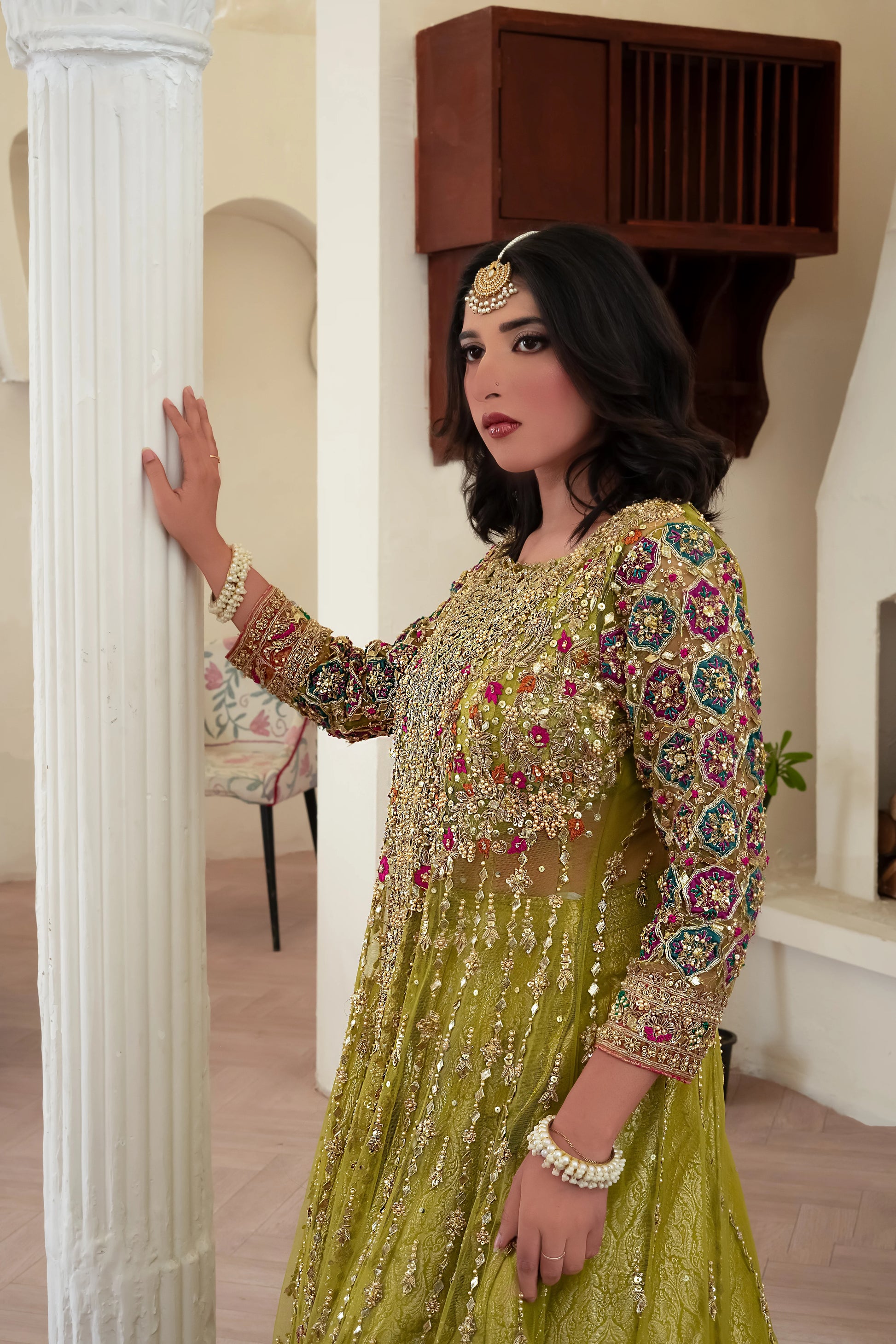 Soft green wedding lehenga choli with net gown and shimmering zari work