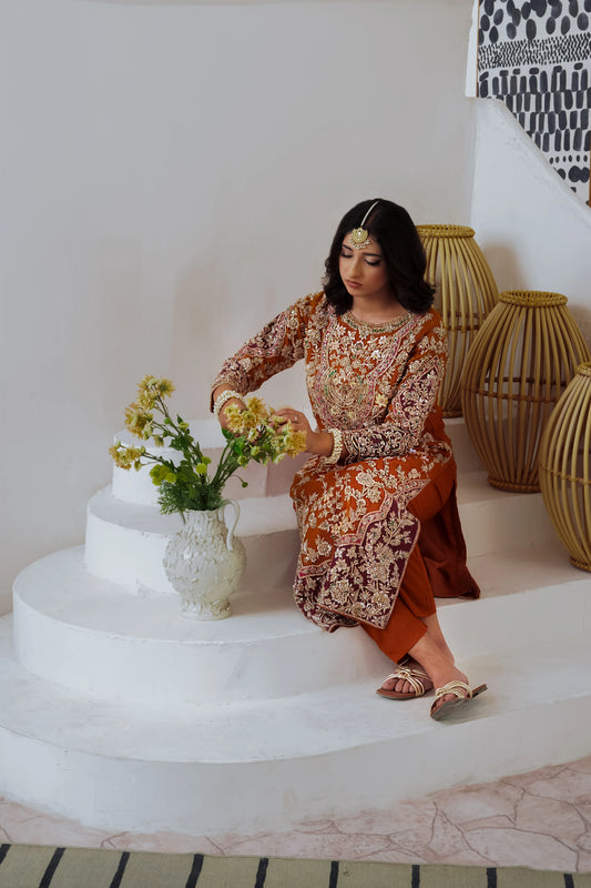 Orange organza wedding outfit with hand-made zari work