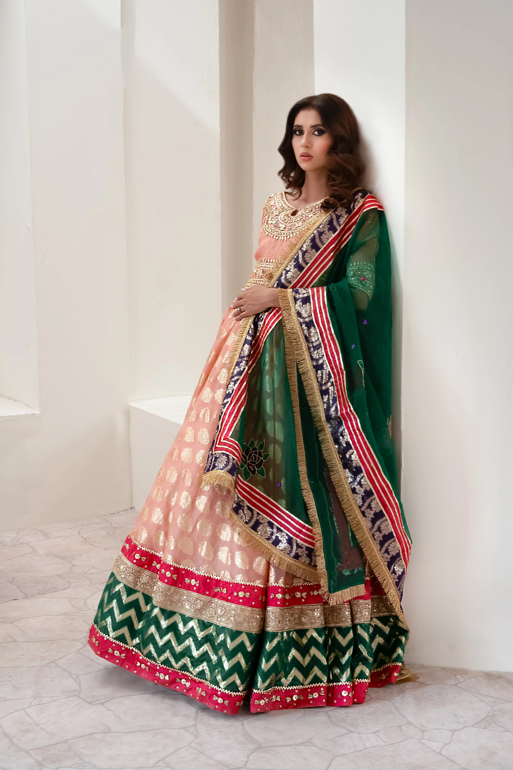 Soft peach lehenga choli wedding outfit with gota work and hand-painted dupatta
