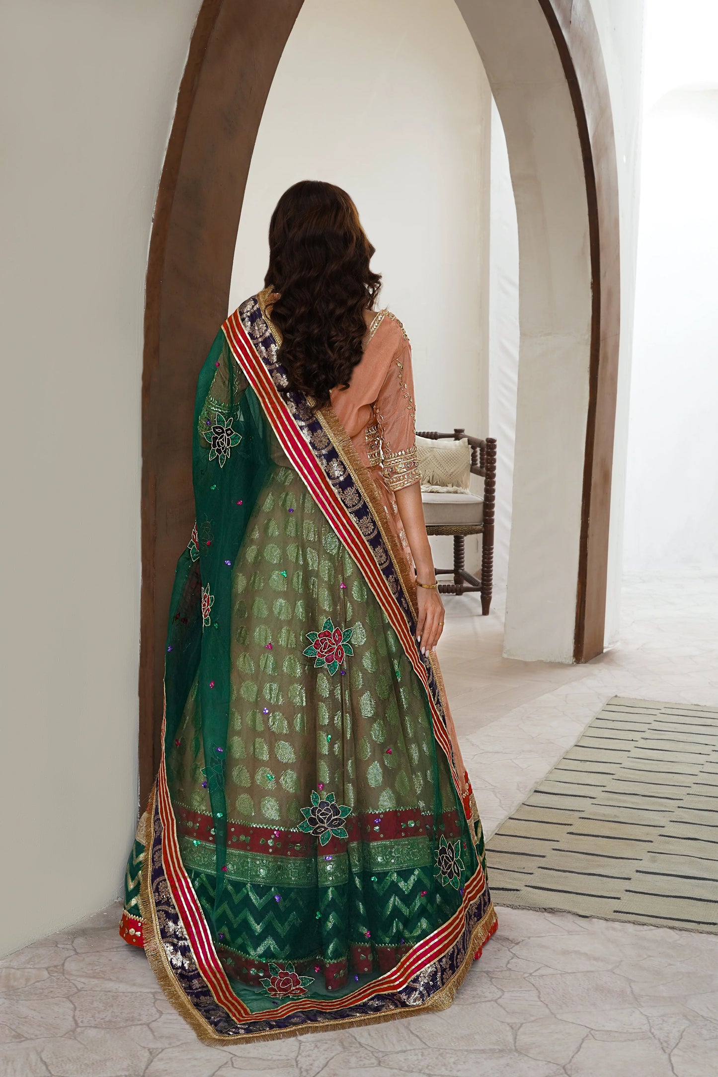 Soft peach lehenga choli wedding outfit with gota work and hand-painted dupatta