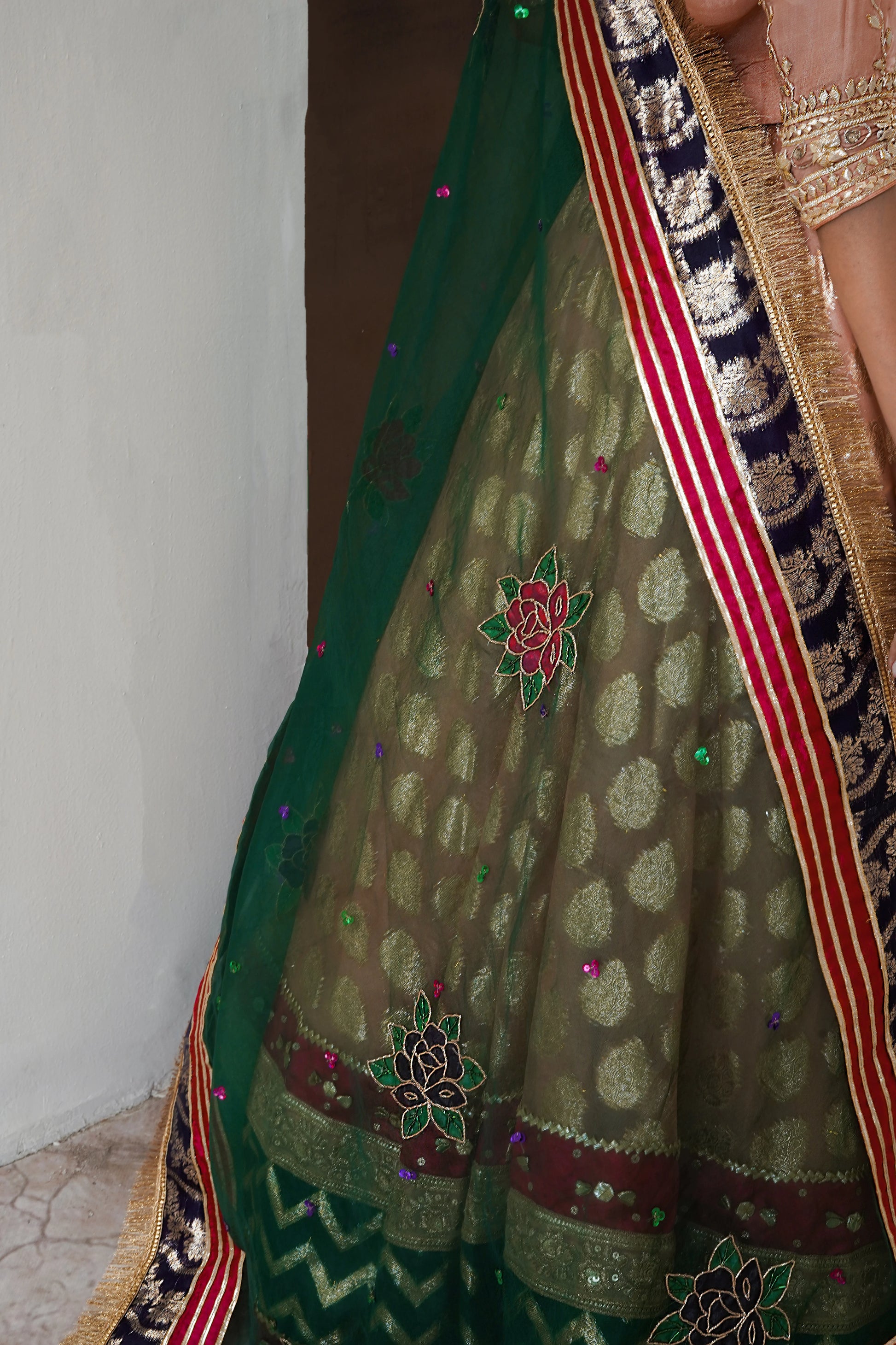 Soft peach lehenga choli wedding outfit with gota work and hand-painted dupatta