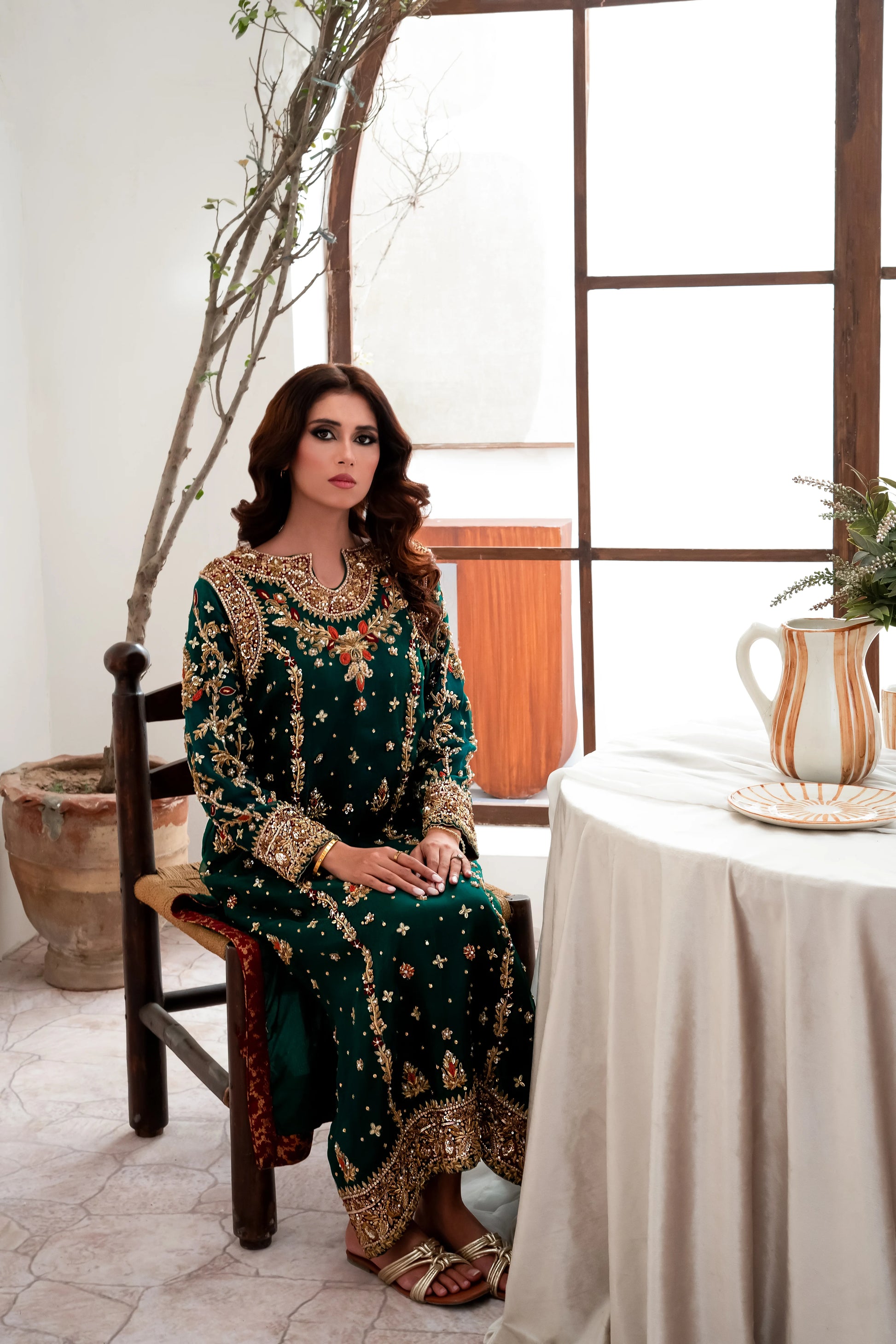 Dark green wedding outfit with hand-made zari work on net