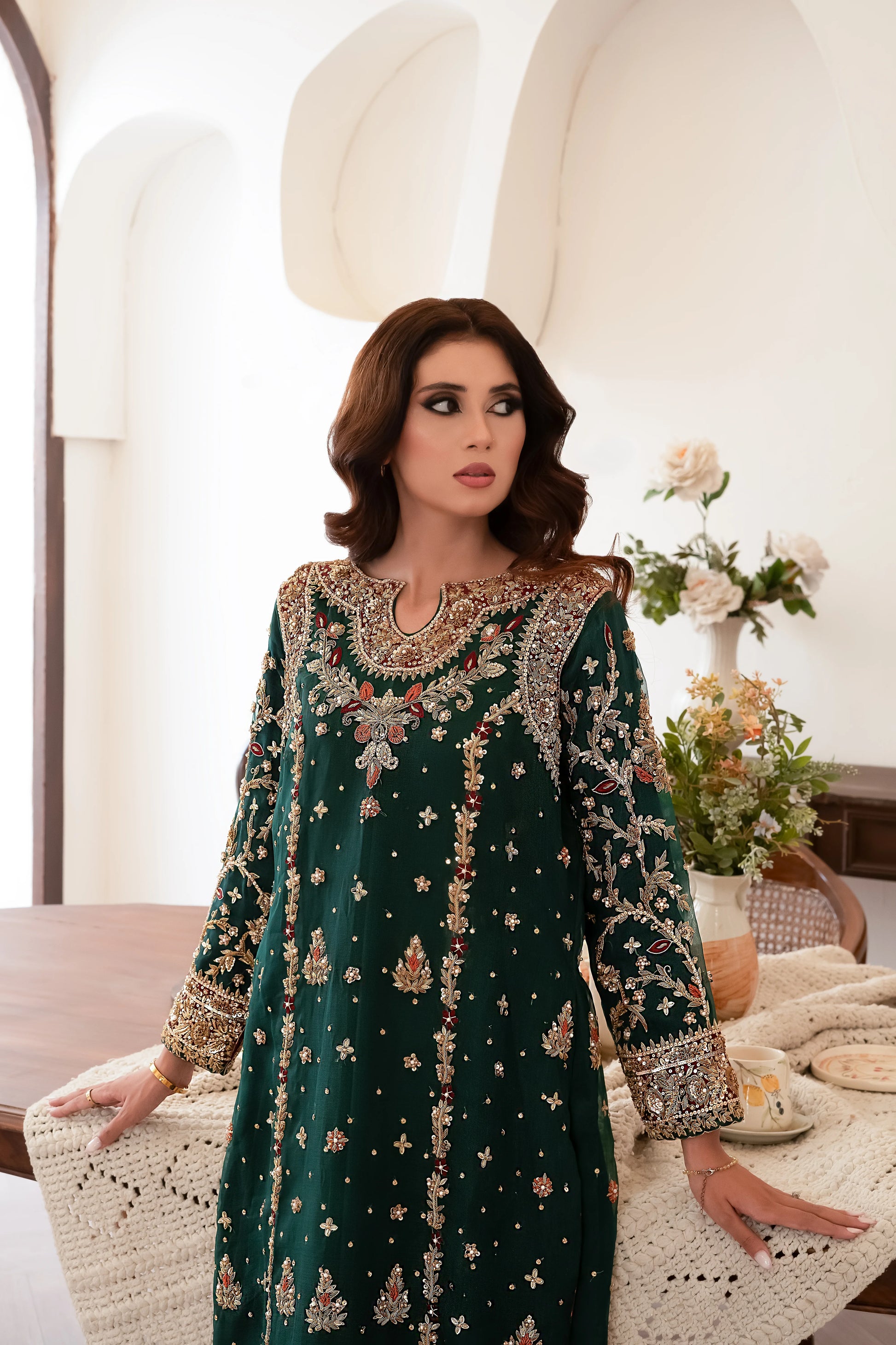 Dark green wedding outfit with hand-made zari work on net