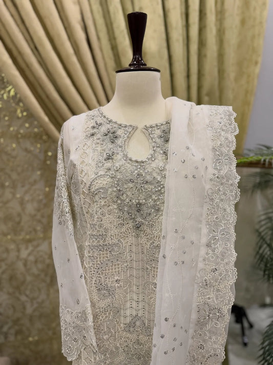 White organza embroidered outfit with delicate embroidery and handcrafted stonework