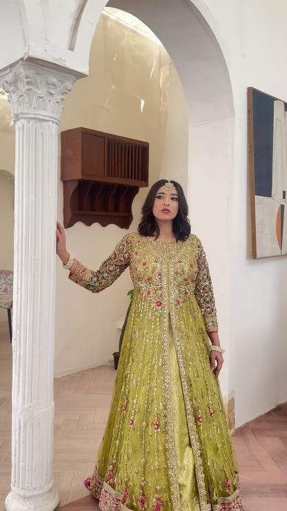 Soft green wedding lehenga choli with net gown and shimmering zari work