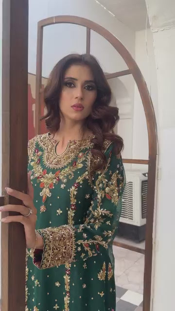 Dark green wedding outfit with hand-made zari work on net