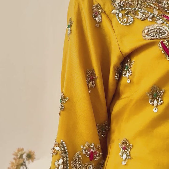 Yellow and zinc gharara wedding outfit with intricate zari and gotta work